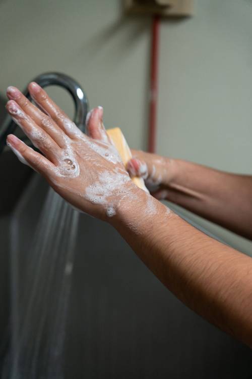 Hands being scrubbed for surgery