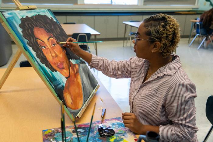 Student Painting a Picture