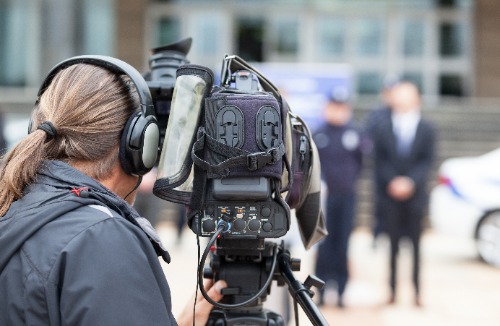 Journalist taking videos