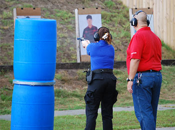 Woman shooting a gun