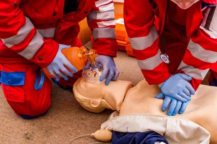 Two men giving CPR