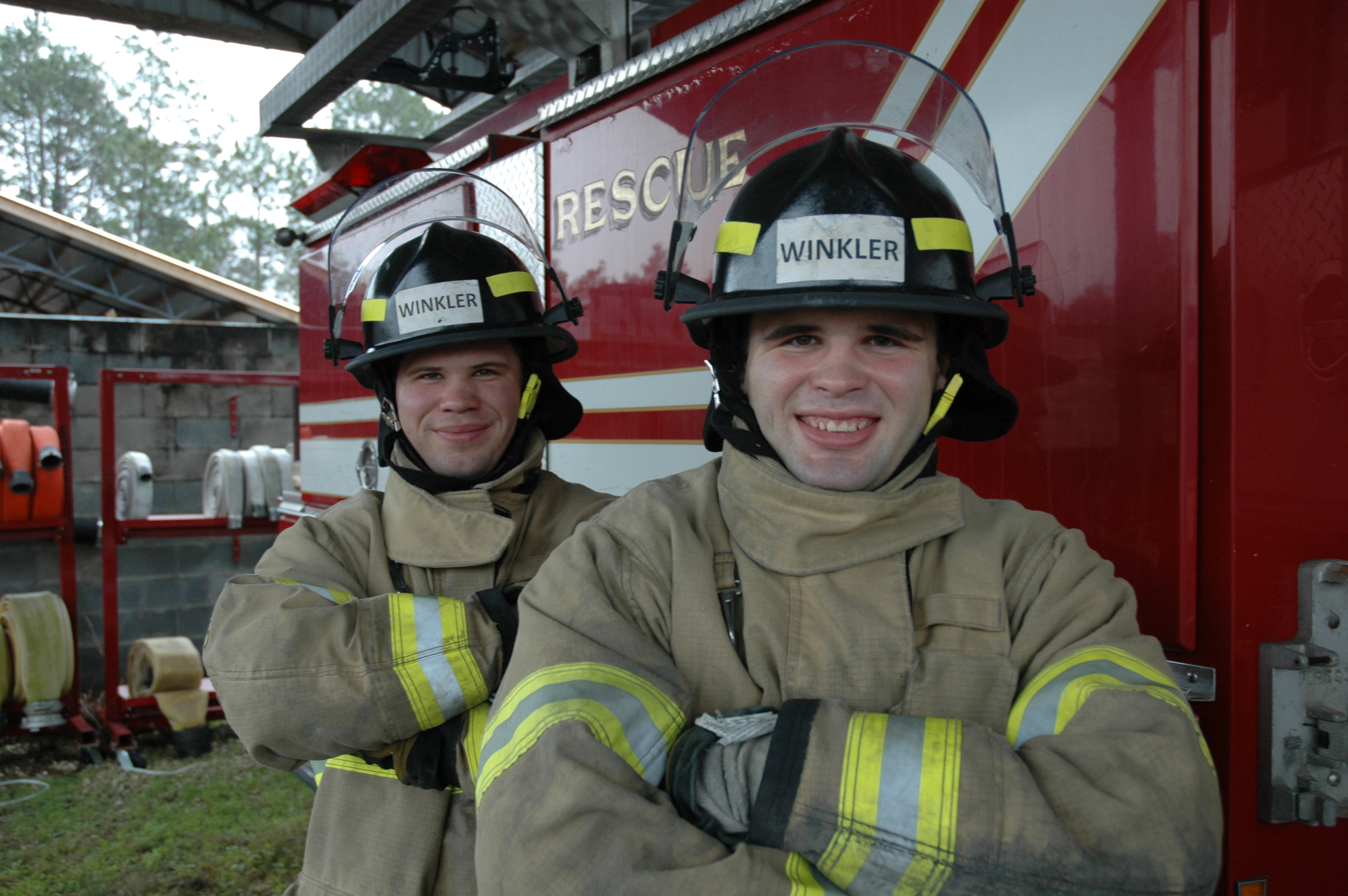 2 students by a fire truck
