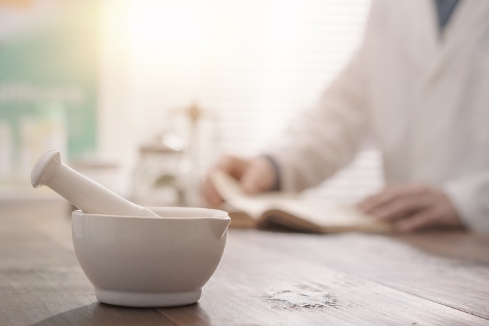 Bowl and Pessel with doctor reading book