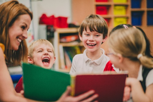 Teacher Reading to Children