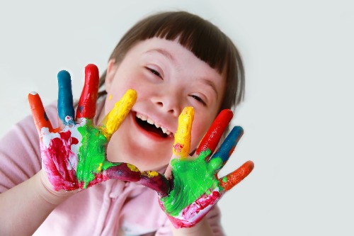 Little girl with painted hands