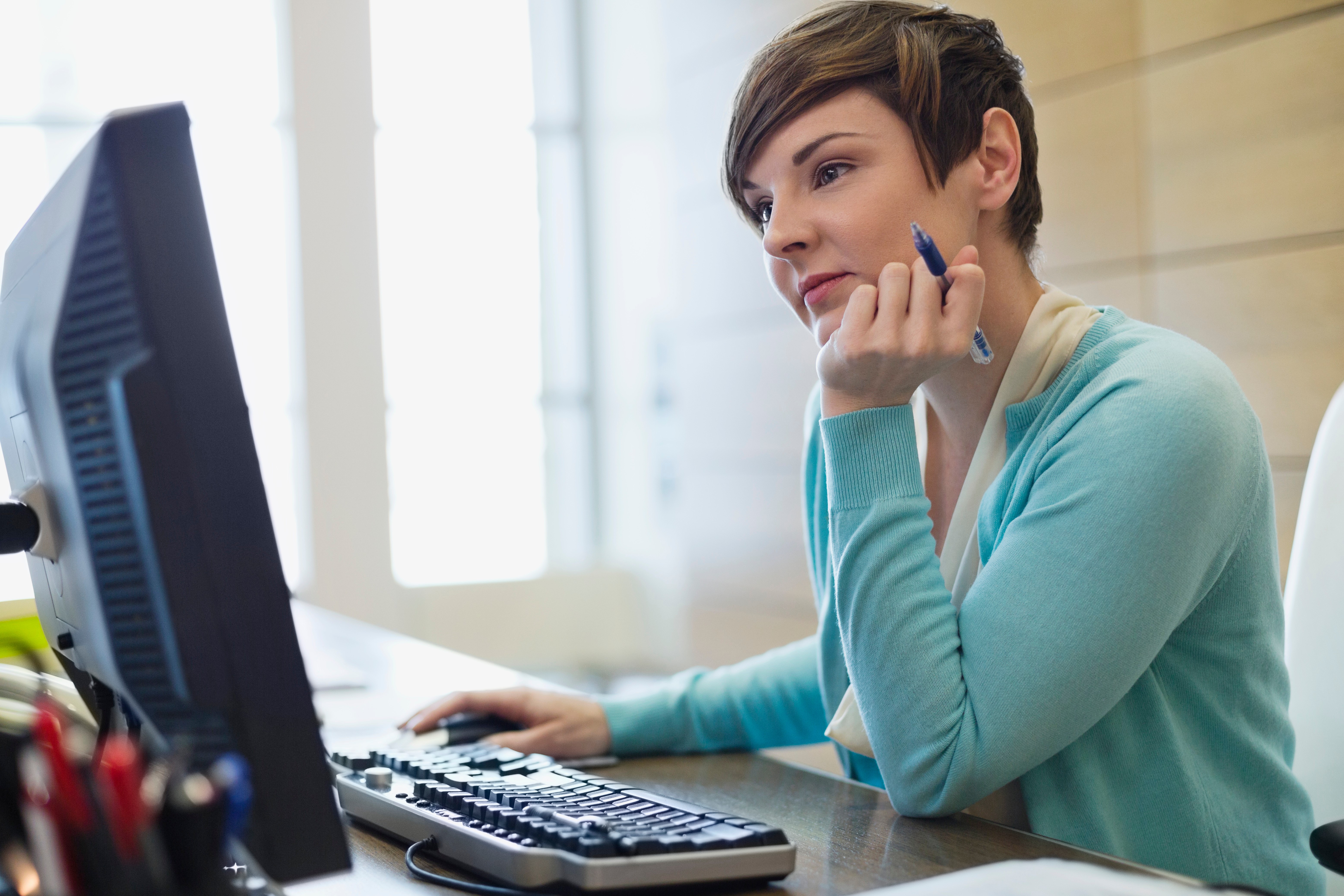 Woman looking at laptop