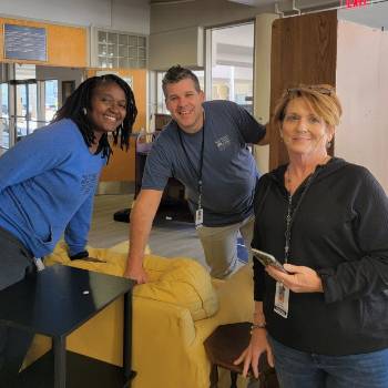 Three employees working the event