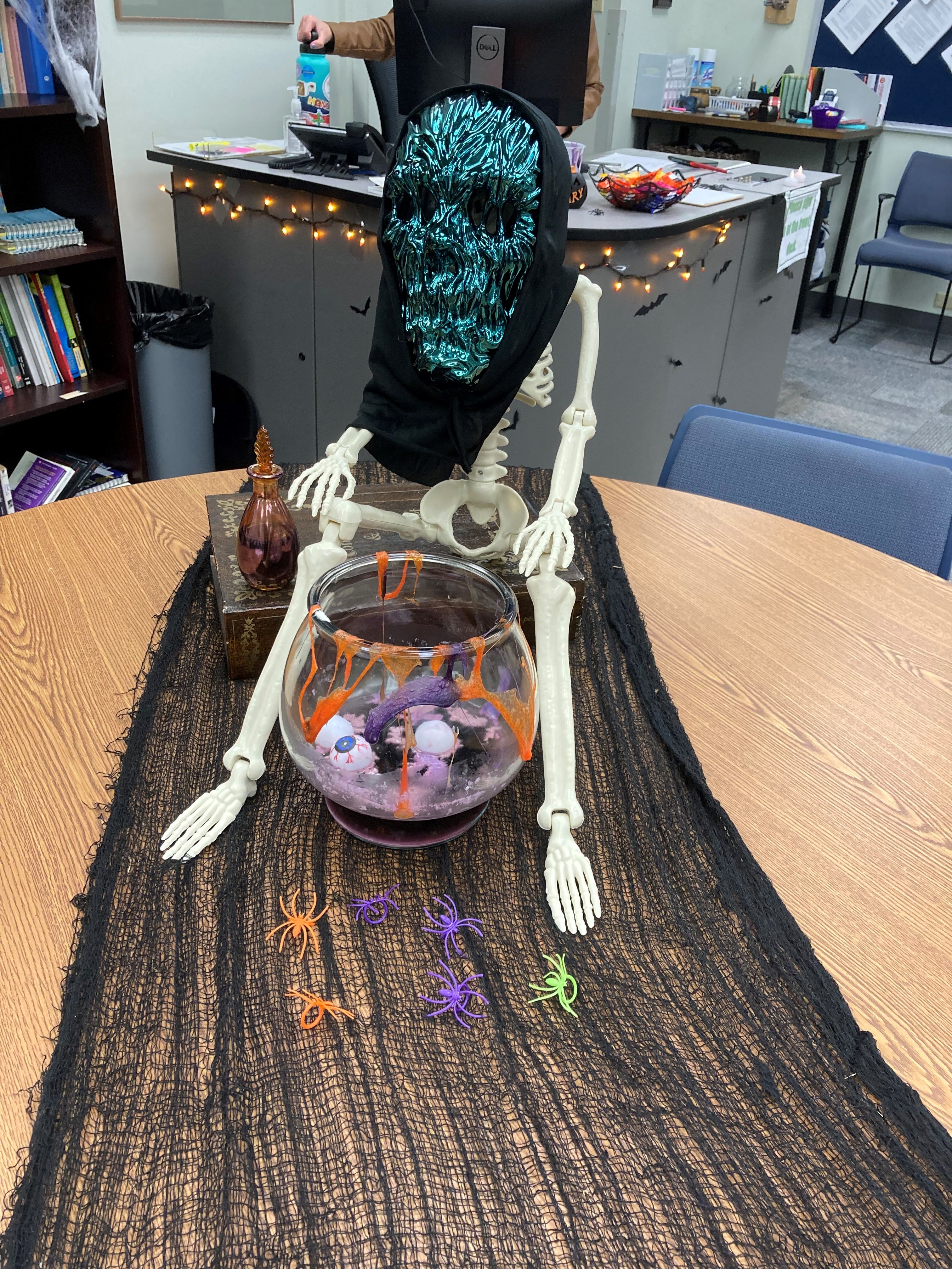 Writing and Reading Lab Halloween Decorations outside the GCSC's Writing and Reading Tutoring Lab. Skeleton sitting in the candy bowl.