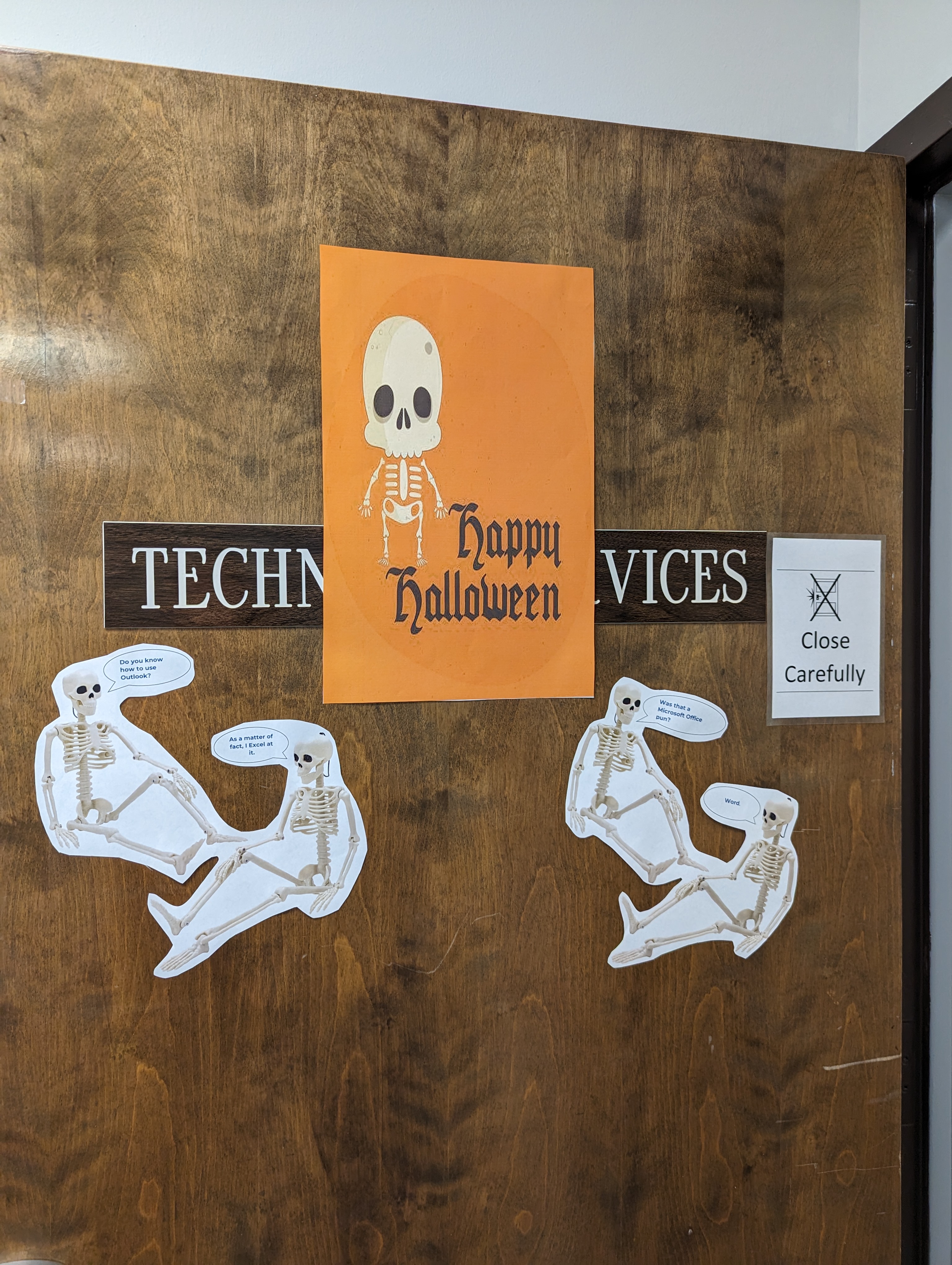 Information Technology Services, ITS Halloween Decorations in GCSC's ITS Building. Skeletons on a door